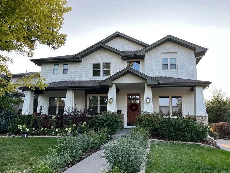 Repainted craftsman-style home with dark brown trim in Denver's Washington Park neighborhood