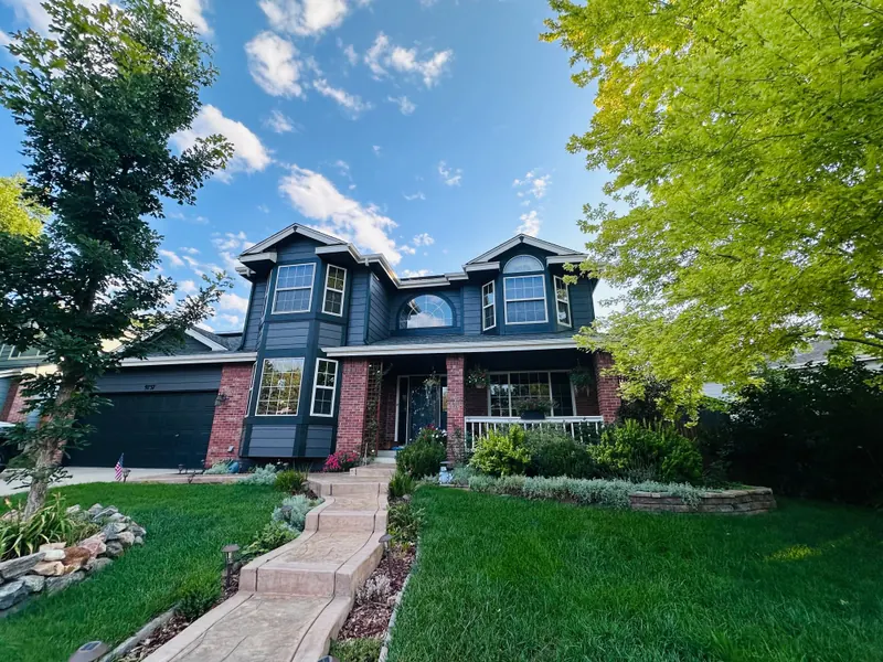 Repainted navy and brick two-story home in Littleton